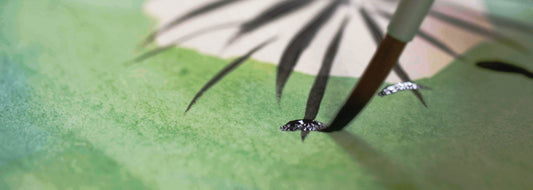close up of partly completed painting of a dandelion in watercolour in watercolour